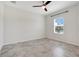 Bright bedroom features a ceiling fan and a window with blinds at 1706 Lake Sims Pkwy, Ocoee, FL 34761