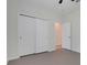 The bright bedroom has a closet and a door to another room at 1706 Lake Sims Pkwy, Ocoee, FL 34761