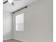 Bright bedroom features a ceiling fan and a window with blinds at 1706 Lake Sims Pkwy, Ocoee, FL 34761
