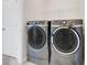 Laundry room with large washer and dryer at 1706 Lake Sims Pkwy, Ocoee, FL 34761