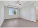 The main bedroom has tray ceiling, large windows, and an ensuite bathroom at 1706 Lake Sims Pkwy, Ocoee, FL 34761