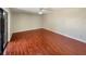 Bright bedroom with sliding glass doors, hardwood floors, and blank walls at 1912 Cattleya Dr, Kissimmee, FL 34741