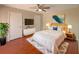 Cozy bedroom featuring a comfortable bed, TV, and stylish decor at 1912 Cattleya Dr, Kissimmee, FL 34741