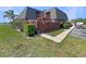 Exterior view of a condo with brown fence, greenery, and a well-maintained lawn at 1912 Cattleya Dr, Kissimmee, FL 34741