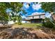 Large backyard with a screened porch, privacy fence, and ample space for outdoor activities at 2020 Corner Glen Dr, Orlando, FL 32820