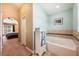 Bright bathroom featuring a large tub with tile surround and ample storage space at 2020 Corner Glen Dr, Orlando, FL 32820