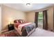 Comfortable bedroom with a decorative rug and ample natural light from the window at 2020 Corner Glen Dr, Orlando, FL 32820