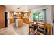 Modern kitchen featuring stainless steel appliances, tile backsplash, a center island and breakfast nook with sliding glass doors at 2020 Corner Glen Dr, Orlando, FL 32820