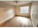 Bedroom with wood floors, a window with blinds, and a closet at 2528 Robert Trent Jones Dr # 1617, Orlando, FL 32835