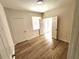 Neutral bedroom featuring wood floors, closet, and entrance to a patio at 2528 Robert Trent Jones Dr # 1617, Orlando, FL 32835