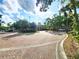 Landscaped brick roundabout at the entrance to the community at 2528 Robert Trent Jones Dr # 1617, Orlando, FL 32835