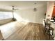 Spacious living area features wood floors, ceiling fan, a pendant light and lots of natural light at 2528 Robert Trent Jones Dr # 1617, Orlando, FL 32835