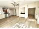 Open living space with hardwood floors, ceiling fan, and kitchen breakfast bar at 2528 Robert Trent Jones Dr # 1617, Orlando, FL 32835