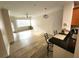 Open floor plan featuring wood floors, ceiling fan and natural light at 2528 Robert Trent Jones Dr # 1617, Orlando, FL 32835