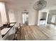 Bright and open floor plan featuring wood floors and modern lighting at 2528 Robert Trent Jones Dr # 1617, Orlando, FL 32835