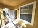 Outdoor patio with access from inside and window with blinds at 2528 Robert Trent Jones Dr # 1617, Orlando, FL 32835