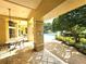 A covered patio offers shade and relaxation near the community pool at 2528 Robert Trent Jones Dr # 1617, Orlando, FL 32835