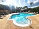 Enjoy this community pool surrounded by lounge chairs and lush landscaping at 2528 Robert Trent Jones Dr # 1617, Orlando, FL 32835