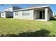 Exterior: Backyard view with a covered patio and sliding glass door at 2731 Forestdale St, St Cloud, FL 34771
