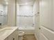 Bathroom featuring a tub, shower, and a sleek vanity with modern fixtures at 2731 Forestdale St, St Cloud, FL 34771