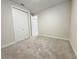 Neutral bedroom offers a carpeted floor, closet, and white painted trim at 2731 Forestdale St, St Cloud, FL 34771