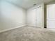Neutral bedroom offers a carpeted floor, closet, and white painted trim at 2731 Forestdale St, St Cloud, FL 34771