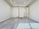 Inviting carpeted bedroom with tray ceiling, recessed lighting, and doors to the hallway and closet at 2731 Forestdale St, St Cloud, FL 34771
