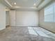 Bright carpeted bedroom with tray ceiling, recessed lights, and a window providing natural light at 2731 Forestdale St, St Cloud, FL 34771