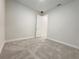 Bedroom featuring neutral carpet and a white door at 2731 Forestdale St, St Cloud, FL 34771