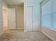 Cozy bedroom with a closet, plush carpeting, and abundant natural light from window at 2731 Forestdale St, St Cloud, FL 34771