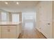 Open-concept kitchen and living space with wood-look flooring at 2731 Forestdale St, St Cloud, FL 34771