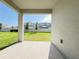 The covered patio provides a seamless transition to the green backyard and complements the home's outdoor living space at 2731 Forestdale St, St Cloud, FL 34771