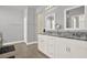 Bathroom showcasing double vanities, granite counters, and tile flooring at 2795 Westyn Cove Ln, Ocoee, FL 34761
