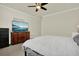 Bedroom featuring tile floors, a TV, and a ceiling fan at 2795 Westyn Cove Ln, Ocoee, FL 34761
