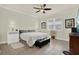 Comfortable bedroom with neutral tones, ceiling fan, and tiled floor at 2795 Westyn Cove Ln, Ocoee, FL 34761