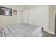 Bedroom featuring a comfortable bed and a spacious closet for ample storage at 2795 Westyn Cove Ln, Ocoee, FL 34761
