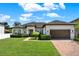 Charming single-story home with well-maintained landscaping and brick paver driveway at 2795 Westyn Cove Ln, Ocoee, FL 34761