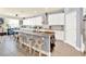 Open kitchen design with large island, bar seating, and modern lighting fixtures at 2795 Westyn Cove Ln, Ocoee, FL 34761