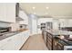 Spacious kitchen showcasing stainless steel appliances, an island and light-colored cabinets at 2795 Westyn Cove Ln, Ocoee, FL 34761