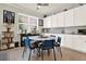 Cozy kitchen dining area with white cabinetry and bright natural light at 2795 Westyn Cove Ln, Ocoee, FL 34761