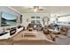Comfortable living room with a modern fireplace, plush seating, and plenty of space at 2795 Westyn Cove Ln, Ocoee, FL 34761