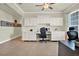 Bright home office with built-in cabinets, desk, and neutral tones at 2795 Westyn Cove Ln, Ocoee, FL 34761