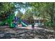Colorful playground with slides and climbing structures nestled in a shaded area, providing a fun and safe environment for children at 2795 Westyn Cove Ln, Ocoee, FL 34761