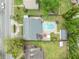 An aerial view of the property shows the house, backyard, pool, shed and surrounding neighborhood at 303 W Par St, Orlando, FL 32804