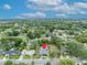 Sprawling property featuring a backyard pool, mature trees, and a well-maintained lawn at 303 W Par St, Orlando, FL 32804