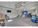 Spacious basement with a TV, ceiling fan, stairs, and stored items at 303 W Par St, Orlando, FL 32804