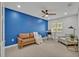 Bright home office featuring blue accent wall, modern desk, and stylish seating arrangements at 303 W Par St, Orlando, FL 32804