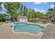 Private backyard oasis features a swimming pool, patio area, landscaping, and a shed at 303 W Par St, Orlando, FL 32804