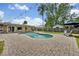 Private backyard oasis features a swimming pool, patio area, and lush landscaping at 303 W Par St, Orlando, FL 32804