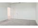 Spacious bedroom featuring neutral carpet and a large closet for ample storage space at 3239 Laurent Loop, Davenport, FL 33837